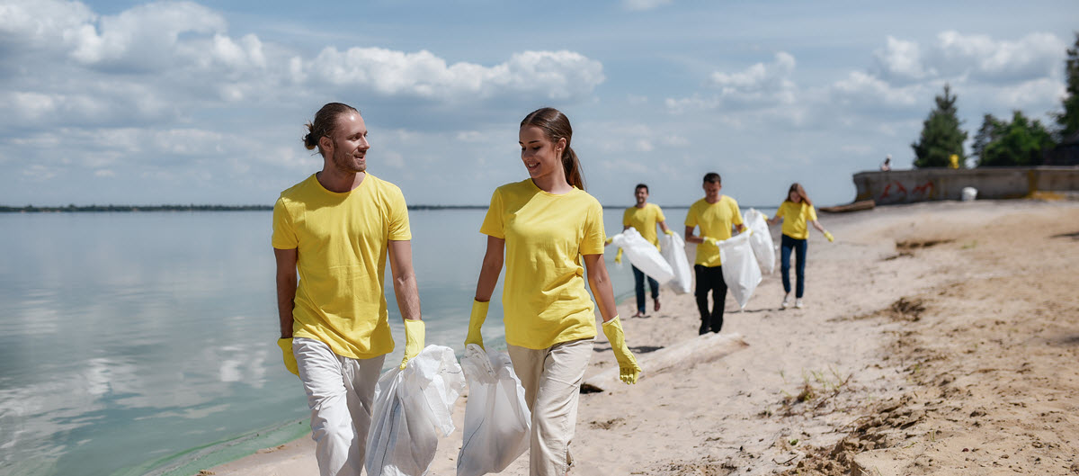 Group of people cleaning beach
