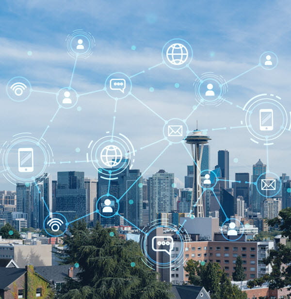 Seattle city landscape photo showing city buildings, with symbols and connected lines illustrating the connectivity
